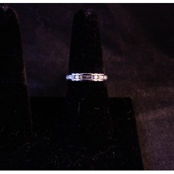 18k white gold and diamond half eternity ring. Set with 4 round cut diamonds totalling .15ct and 3 baguette cut diamonds totalling .37ct. Size O. Price includes nationwide delivery