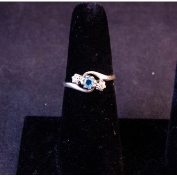9k white gold ring with blue topaz and diamond stones. Size O. Price includes nationwide delivery.