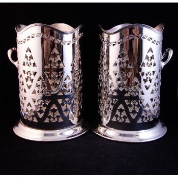 Pair of silver plated pierced bottle coasters. Measures 6"W x 8"H