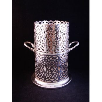 Pierced silver plated two handled bottle coaster. Measures 7"W x 7.5"H